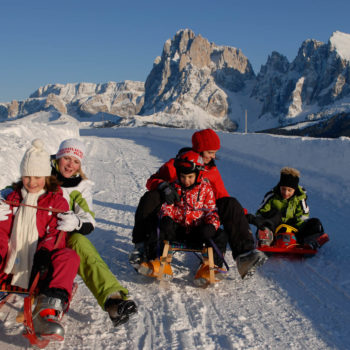 Sledding in winter on the Alpe di Siusi